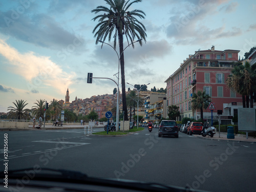 On the seashore road in Menton, French Riviera at sunset in summer