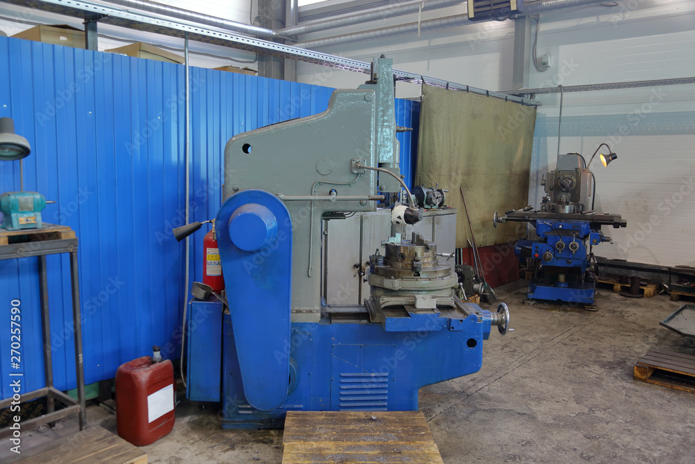 Retro industrial machine for metalworking in the factory workshop Retro industrial machine for metalworking in the factory workshop