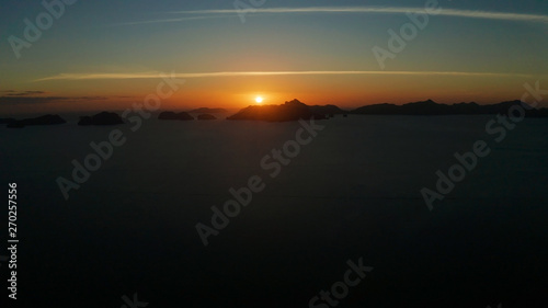 sunset over the sea background of mountains. El nido, Philippines, Palawan. seascape with tropical islands at sunset time. Summer and travel vacation concept