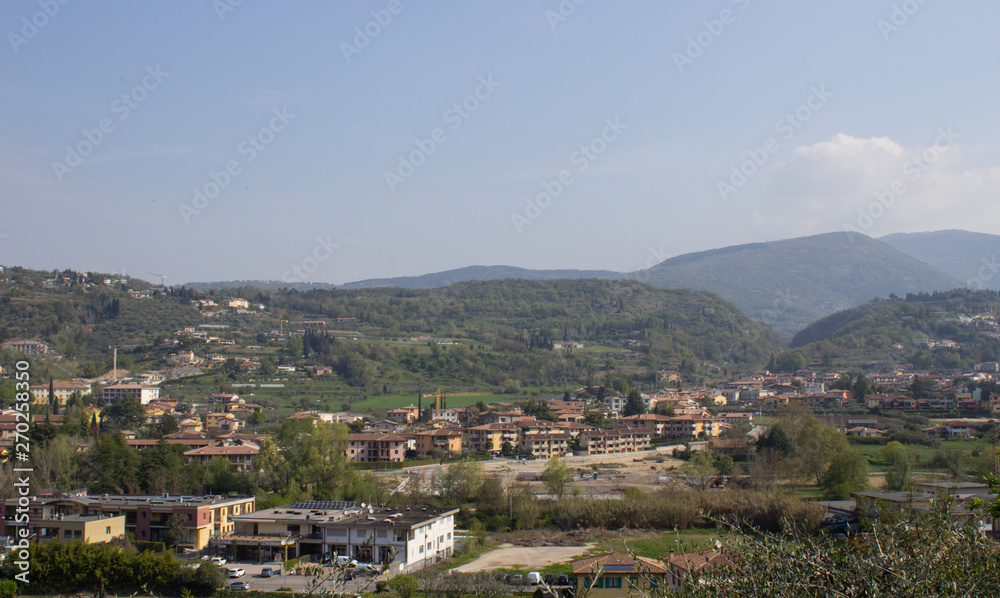 View of houses in the valley near mountains