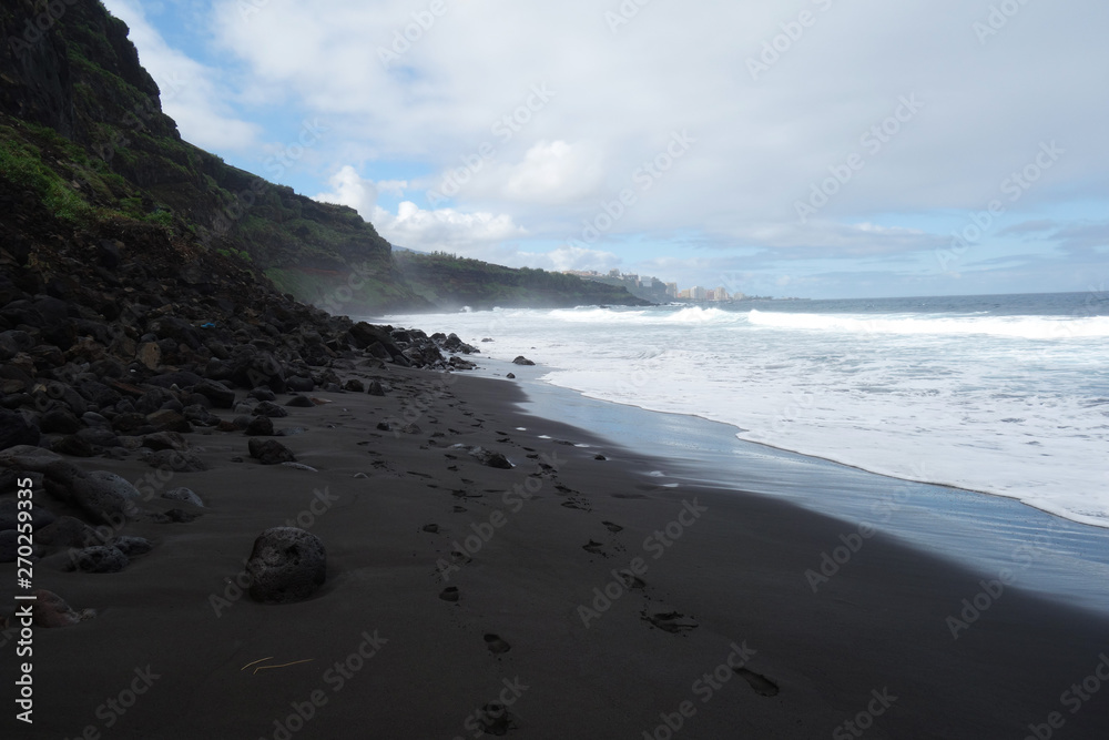 Alone at the black sand beach at Tenerife island