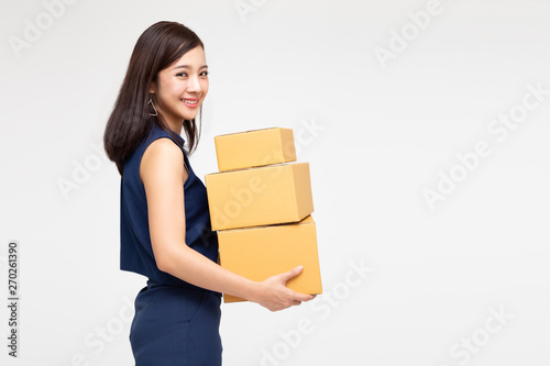 Happy Asian woman holding package parcel box, Delivery courier and shipment service concept © comzeal