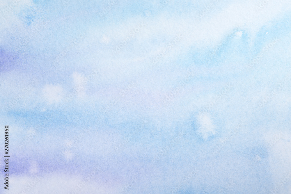 Obraz premium watercolor background filled blue light transparent with drips of paint spread over the paper. on textured watercolor paper paint
