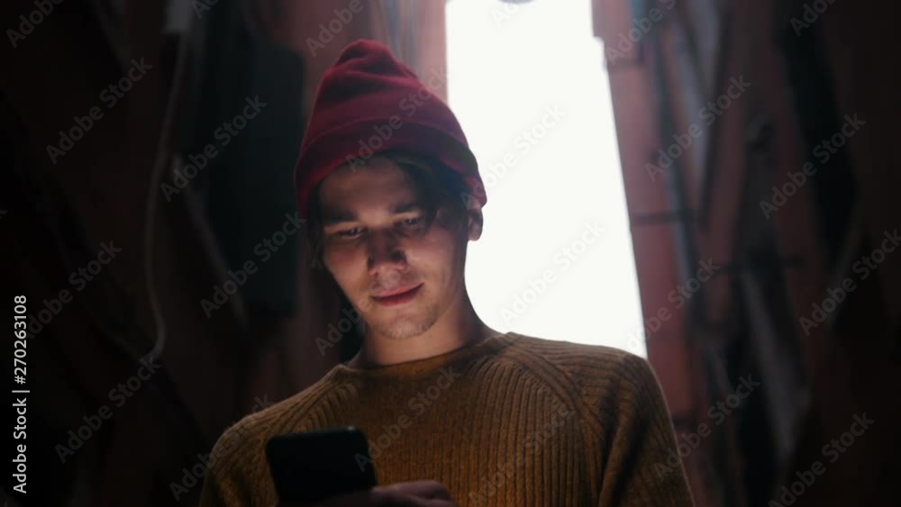 A man walking on the street and looking at the phone screen A man walking on the street and looking at the phone screen