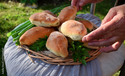 Homemade yeast buns with eggs and green onion filling. Outdoor food photo