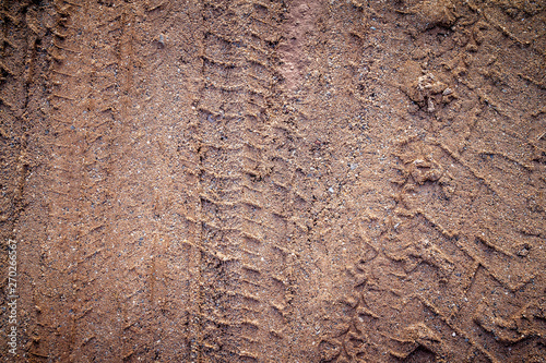 motorcycle tire track print on sand or mud with selective focus © tendo23