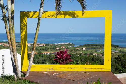 View of Caribbean Ocean through yellow frame photo