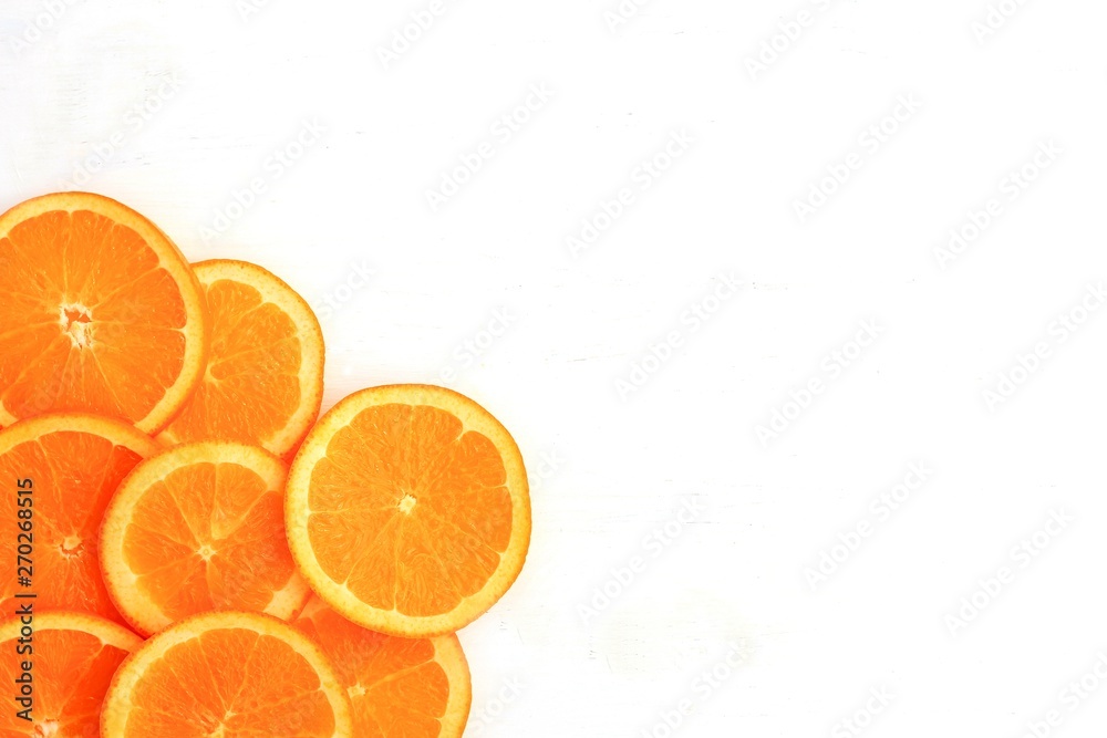 Slices of orange on white background. Flat lay, top view. Slices of orange on white background. Flat lay, top view.