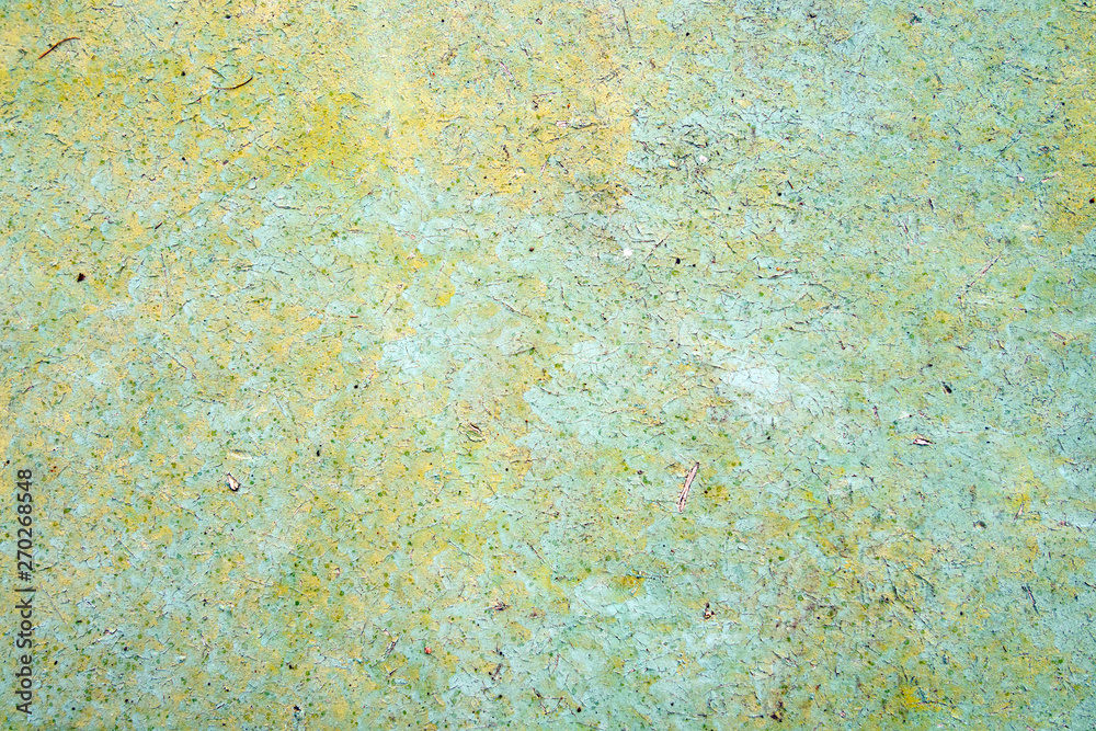 old painted cracked background, textured wall of green, yellow and blue colors old painted cracked background, textured wall of green, yellow and blue colors