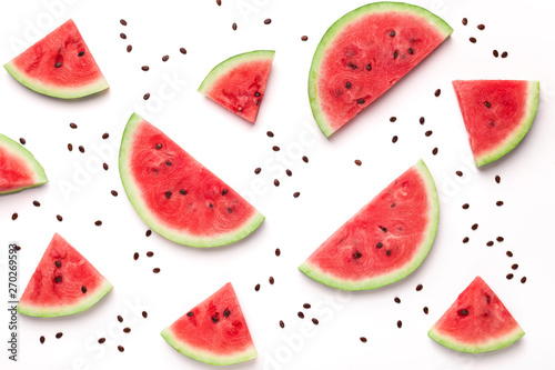 Sliced watermelon and seeds on white background