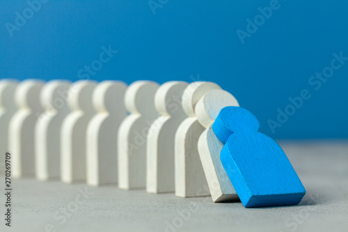 Domino effect in business. One businessman leader falls and brings down other figures of employees. System disruption.