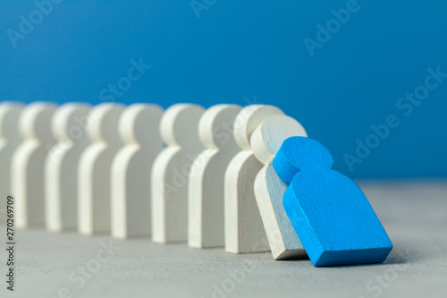 Domino effect in business. One businessman leader falls and brings down other figures of employees. System disruption.