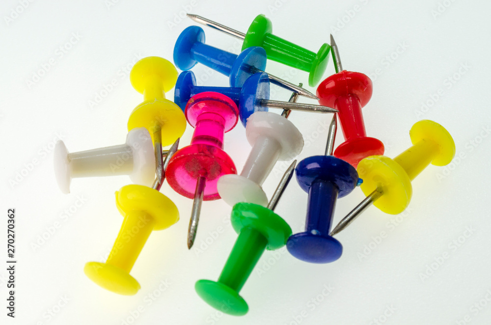 Colored stationery buttons close-up on white background without shadows Colored stationery buttons close-up on white background without shadows