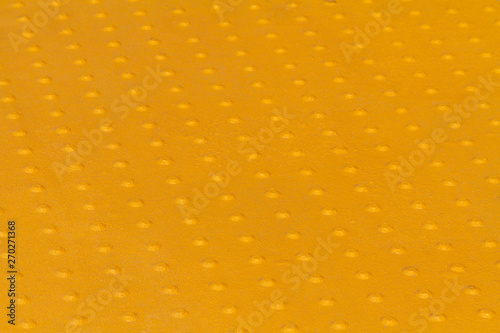 Yelloow tactile paving  bumps close-up