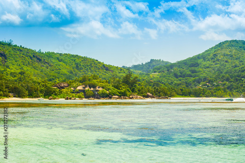 Fototapeta Naklejka Na Ścianę i Meble -  Beautiful tropical landscape with green hills on the shores of the Indian Ocean