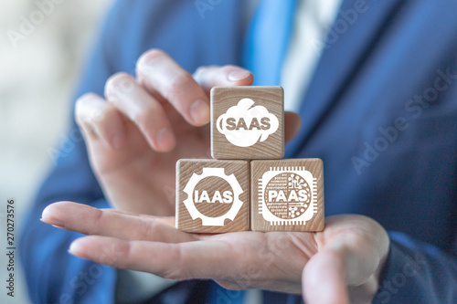 Saas Iaas Paas Xaas Services on a wooden blocks in a businssman hands. Software Infrastructure Platform Technology.