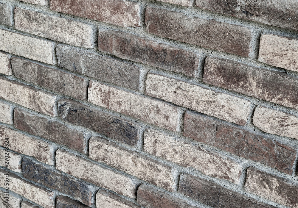 Naklejka premium Background of rustic sandblasted bricks wall.