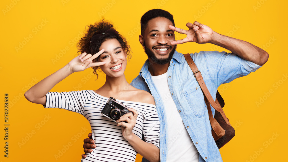 Obraz premium Young Couple Ready For Trip, Orange Background