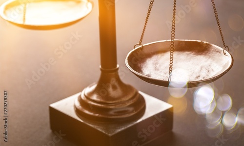 Law scales justics scale weighing old lawyer litigation