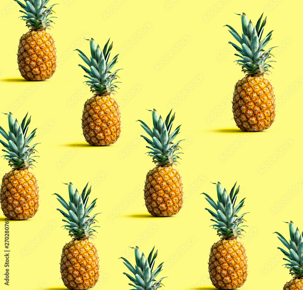 Many pineapples on a solid color background Many pineapples on a solid color background