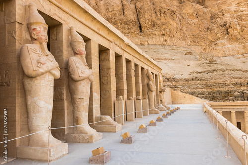 Hatshepsut statues by the columns on the highest terrace of the Mortuary Temple of Hatshepsut, Luxor, Egypt