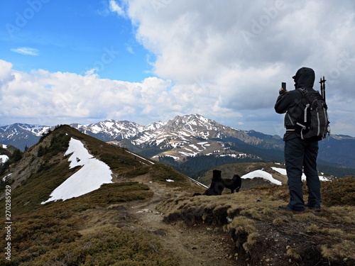 Man and dogs hiking in the mountains