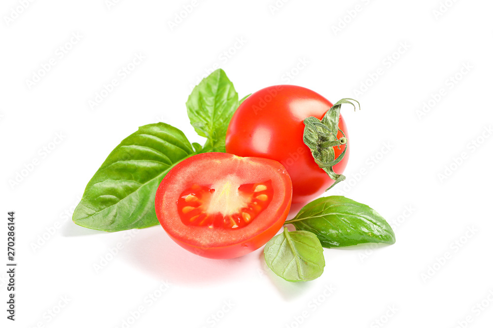 Fresh cherry tomatoes with basil isolated on white background. Ripe vegetables