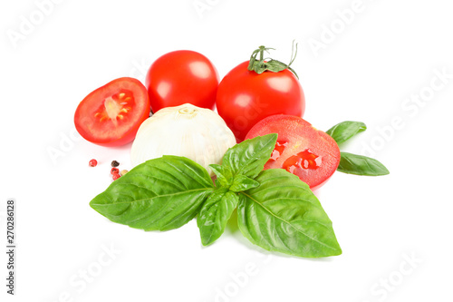 Fresh cherry tomatoes with basil, spices and garlic isolated on white background. Ripe vegetables