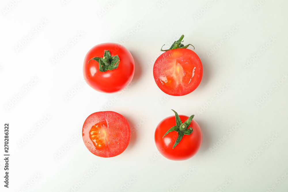 Flat lay composition with fresh cherry tomatoes on white background, space for text. Ripe vegetables Flat lay composition with fresh cherry tomatoes on white background, space for text. Ripe vegetables