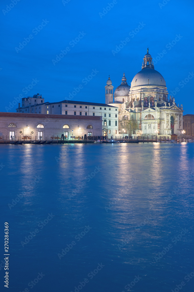  Illuminated church Santa Maria della Salute in Venice, Italy at night, copy-space