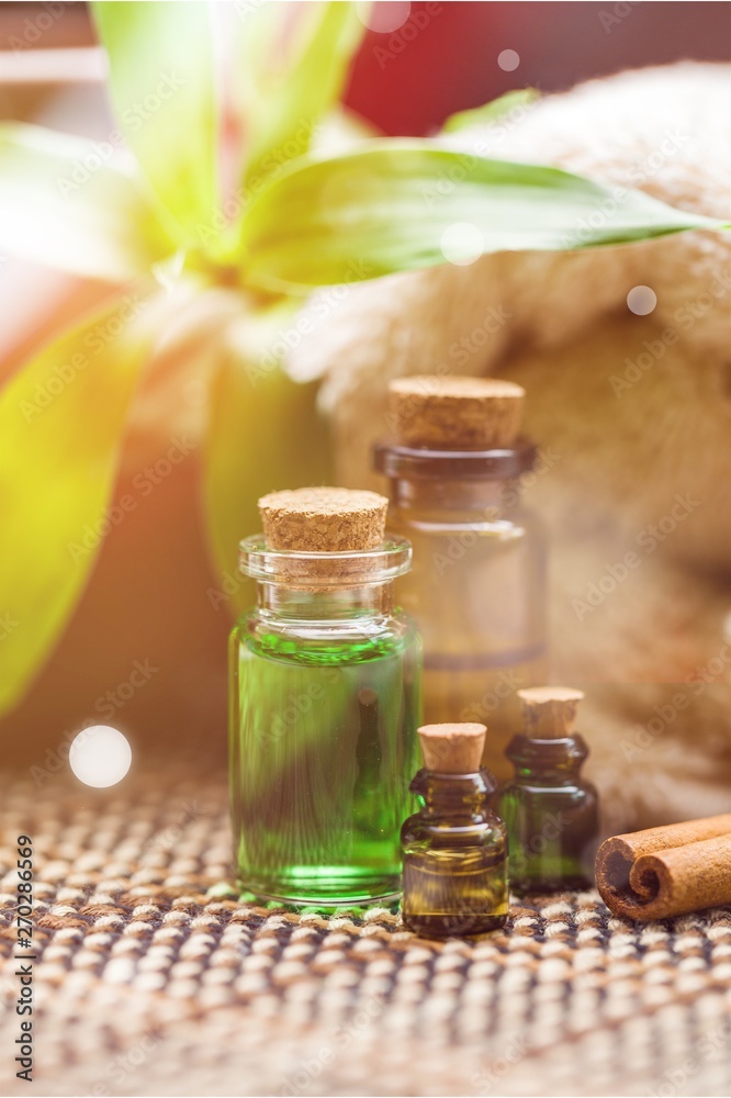 Spa Bottles and Wellness Setting on wooden desk Spa Bottles and Wellness Setting on wooden desk