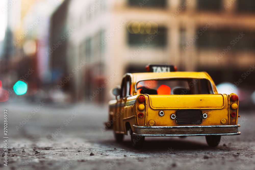miniature yellow taxi cab in the city miniature yellow taxi cab in the city