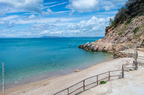 Fototapeta Naklejka Na Ścianę i Meble -  Mediterranean sea beach and rocks cliff tuscany Italian landscape