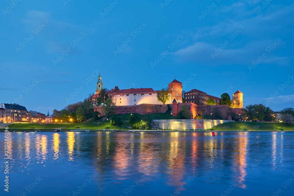 Poland, Krakow, Wawel hill at night, evening view from the other bank of river Poland, Krakow, Wawel hill at night, evening view from the other bank of river