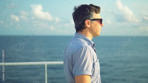 Marine navigational officer during navigational watch on Bridge . Work at sea photo