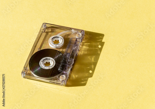 Canvas-taulu retro transparent audio cassette with copy space for text on yellow background
