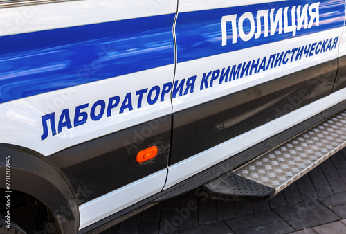 Inscription "Police, Crime lab" on the board of russian police vehicle