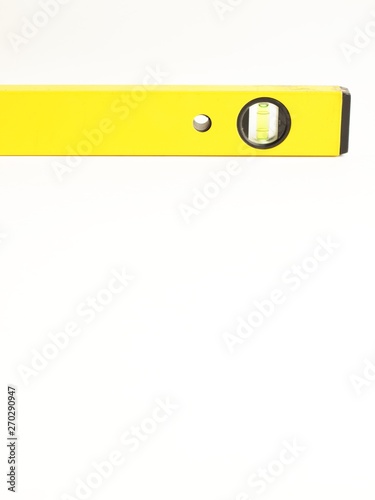 repair and construction tools concept. building spirit level isolated on a white background close up. front view with copy space for text.