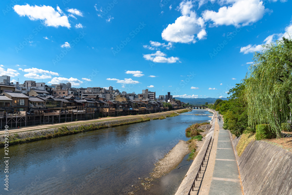 Beautiful scenery of Kamo River or Kamogawa in Kyoto City, Japan. Ancient wooden houses on the riverbanks are transformed into restaurants, a popular walking spots for residents and tourist.