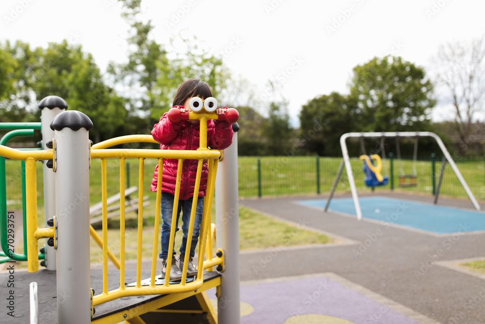Fototapeta premium toddler girl play at Spring outdoor playground