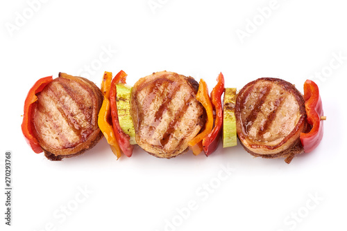 Grilled Meat medallions wrapped in bacon, top view, isolated on white background