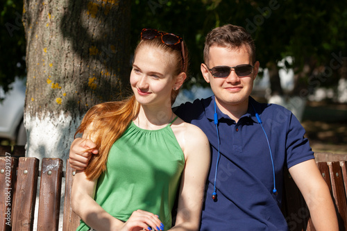 Couple in love. Romantic couple enyojing in moments of happiness in the park. Love and tenderness, dating, romance. Lifestyle concept photo