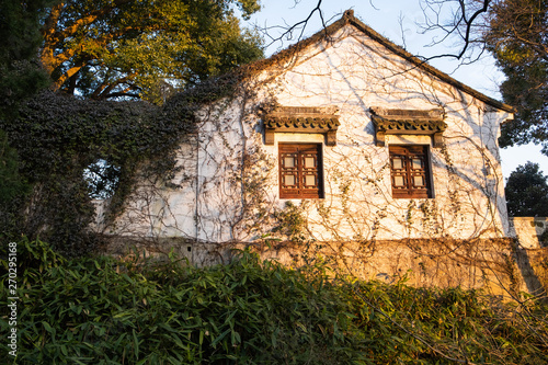 Ancient village house with white walls in the Tiger Hill park in China, Suzhou © Pavel