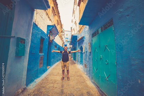 tourist traveling in chefchaouen, Morocco. chefchaouen is famous as to be the blue city of Africa © photomaticstudio