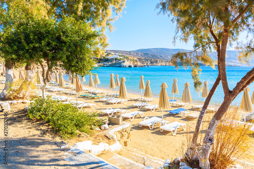 Fototapeta Naklejka Na Ścianę i Meble -  Umbrellas and chairs on beautiful Amopi beach, Karpathos island, Greece