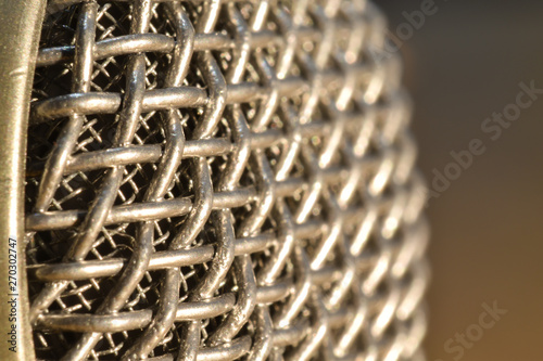 Close up shot of retro microphone mesh at angle