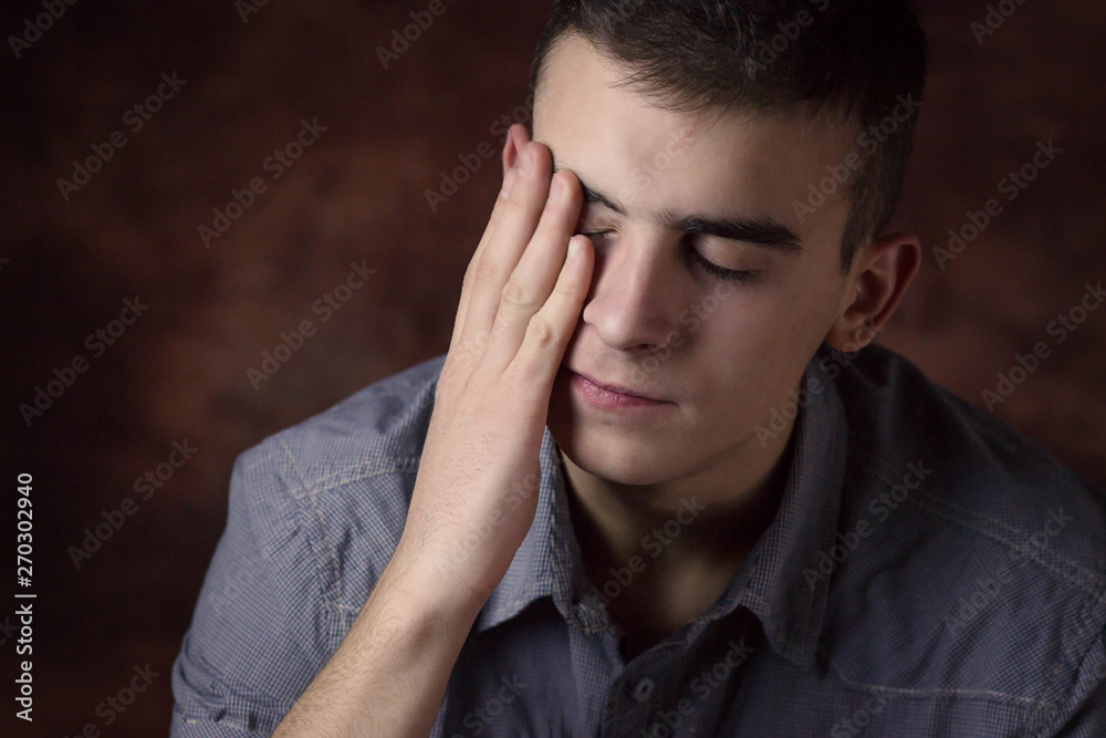 Young man being upset, worried. Human facial expression, body language Young man being upset, worried. Human facial expression, body language