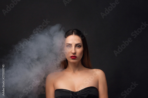 Smoke enveloping a beautiful woman.