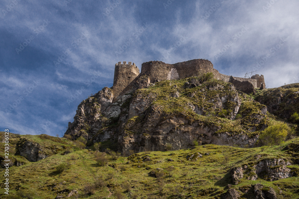 atskuri fortress on hilltop with blue sky atskuri fortress on hilltop with blue sky