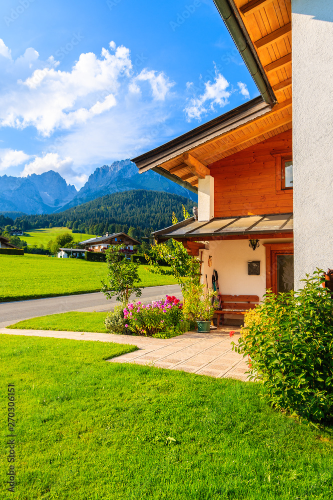 Traditional alpine house in village of Going am Wilden Kaiser on beautiful sunny summer day, Tirol, Austria